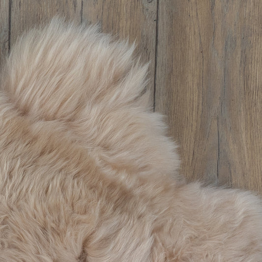Beige sheepskin rug